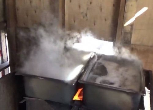 Boiling raw maple sap into pure maple syrup