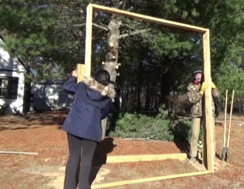 Mounting the solar panel rack on its posts Mounting the solar panel rack on its posts