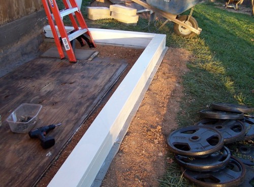 Banking clay along the foundation Banking clay along the foundation