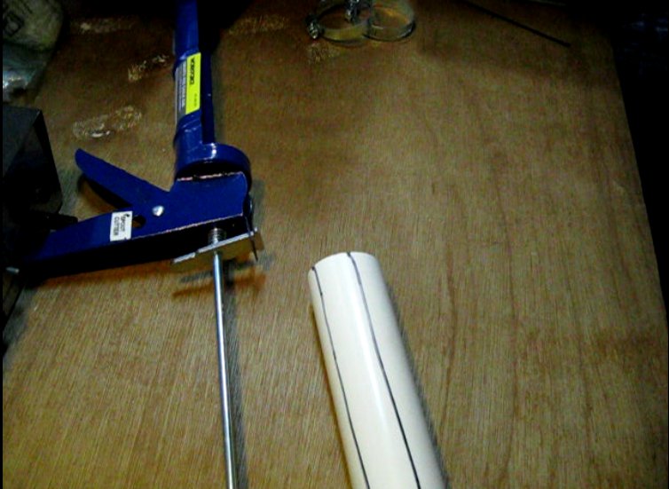 Marking PVC Pipe For Caulk Gun Biomass Press