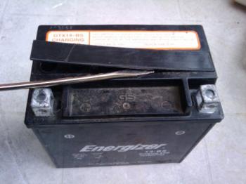 Use a screwdriver to pry off the battery lid